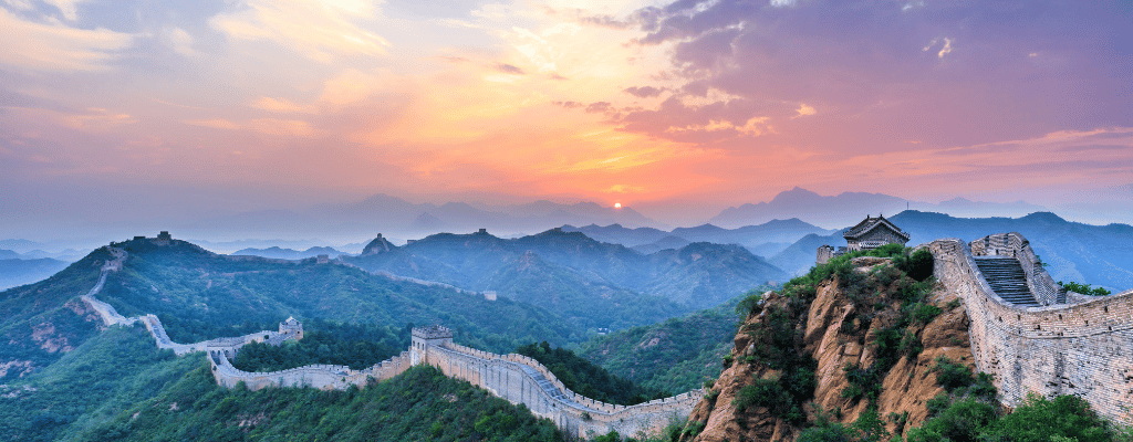The Great Wall of China stretching across the mountains – a historic military landmark and one of the Seven Wonders of the World.