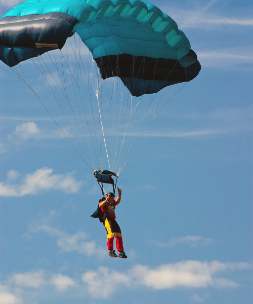 Skydiver soaring over Banff, Canada – a breathtaking adventure above snow-capped mountains and alpine forests