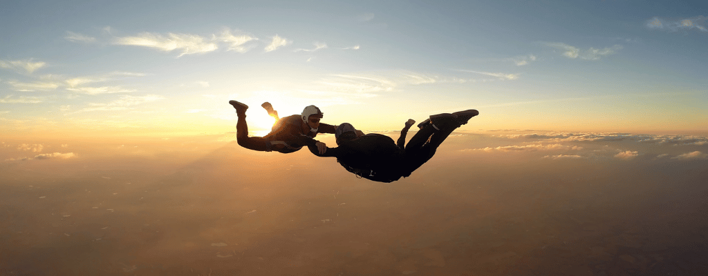 Skydiver soaring over Palm Jumeirah in Dubai – iconic aerial view of the man-made island and city skyline