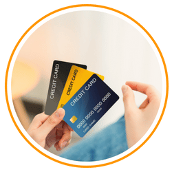 a person is holding 3 credit card