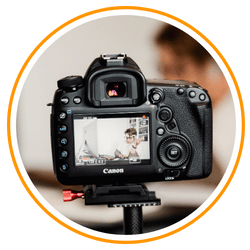 a camera is shooting a video of busy person