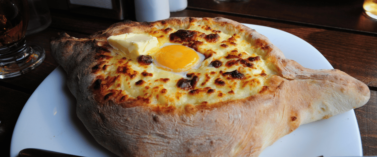 Butter and a freshly cooked egg served on a warm roti, a simple and traditional homemade meal.