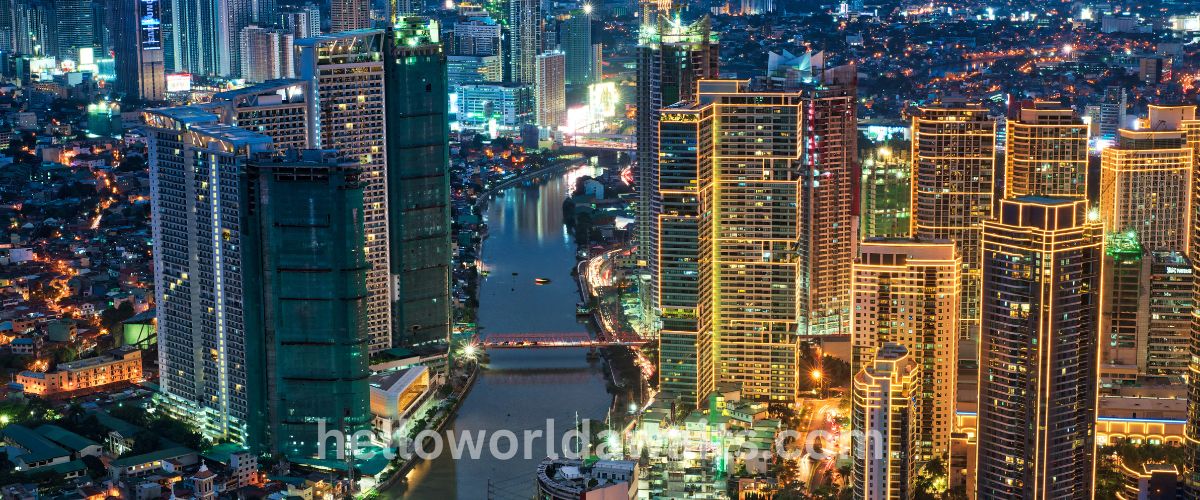 A circular-cropped night view of the Makati business district skyline in Metro Manila, Philippines, showing lit skyscrapers under a twilight sky