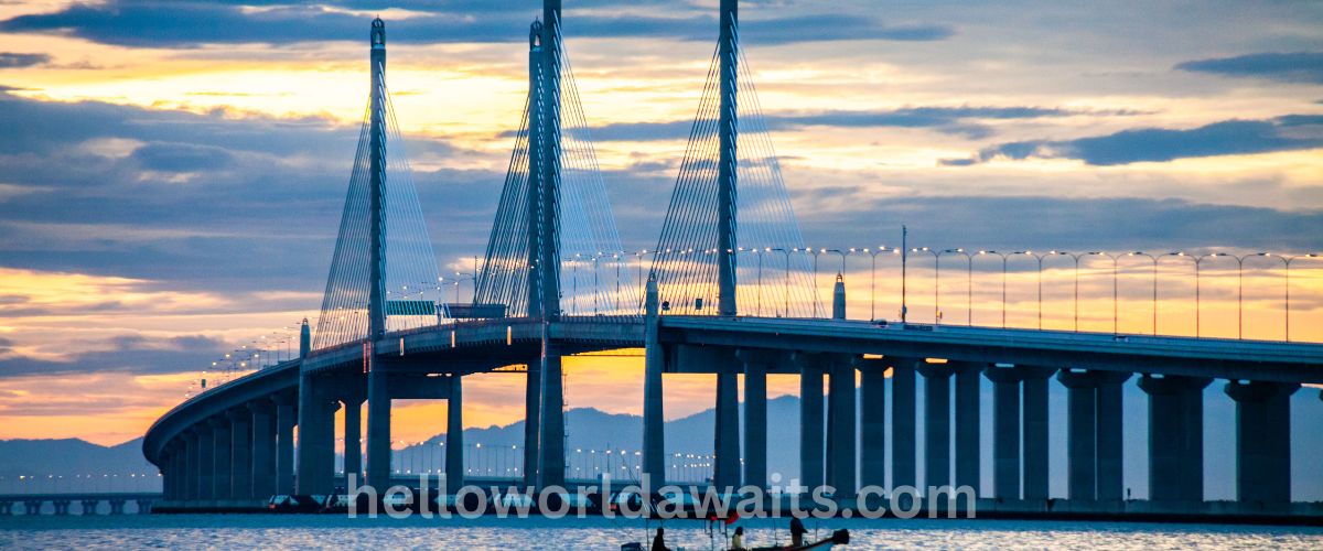 image is describe a beautiful sunset in malaysia on a bridge
