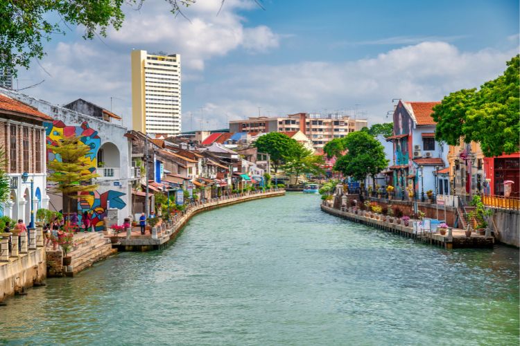 Colorful riverside buildings and mural art in Malacca, Malaysia.