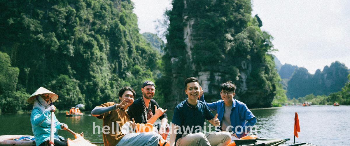 Ancient 12th-century rock-cut granite statues of the Buddha at Gal Vihara in Polonnaruwa, Sri Lanka. The image shows a tall standing Buddha with crossed arms next to a large reclining Buddha, framed by lush green Bodhi tree leaves